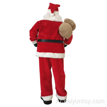 Стоящая плюшевая фигура Санта -Клауса с пакетом омелы